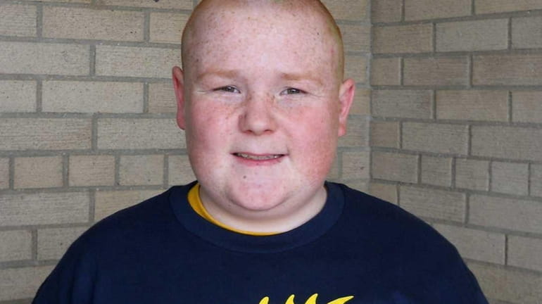 Chris Walsh of Commack has his head shaved every year...