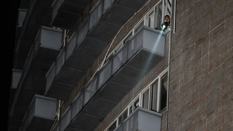 In this photo released by Xinhua News Agency, a firefighter...