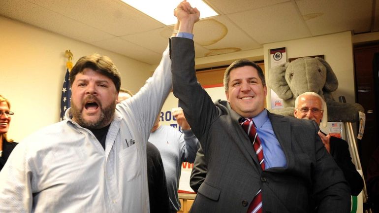 Brookhaven Town Republican Committee chairman Jesse Garcia celebrates with newly...