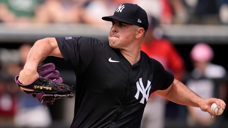 Yankees starting pitcher Carlos Rodon throws in the third inning...