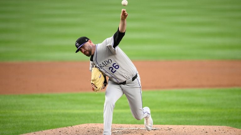 Colorado Rockies starting pitcher Austin Gomber throws during the second...