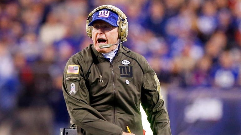 Coach Tom Coughlin of the Giants reacts to a play...
