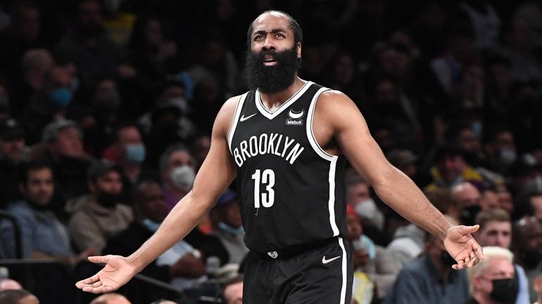 Nets guard James Harden reacts to a call in the...