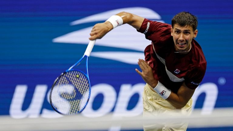 Alexei Popyrin, of Australia, serves to Frances Tiafoe, of the...