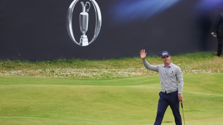 Billy Horschel of the United States waves as he walks...