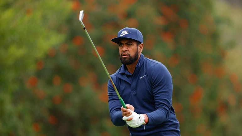 Tony Finau hits from the fourth tee during the third...