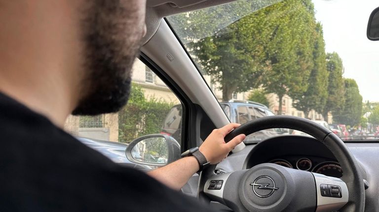 Amine, a 21-year-old student and apprentice bank worker, drives to...