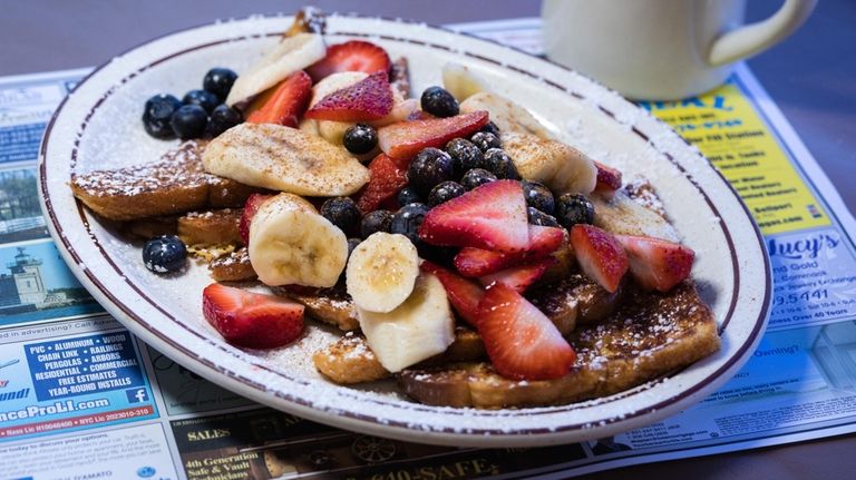 French toast served with fresh fruit at BLT Cafe in...