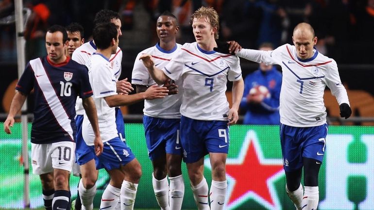 Dirk Kuyt of the Netherlands celebrates his first-half goal during...