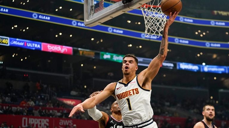 Denver Nuggets forward Michael Porter Jr. (1) reacts after being...