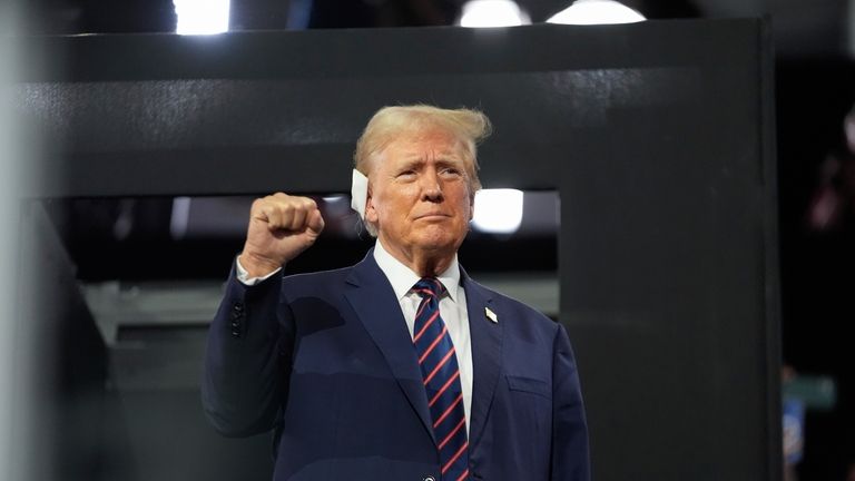 Republican presidential candidate former President Donald Trump gestures as he...