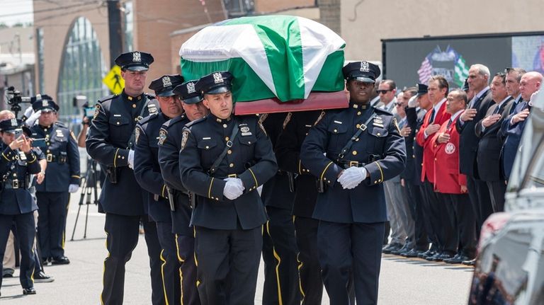 Officers bear Emilia Rennhack's coffin out of the New Hyde Park Funeral...