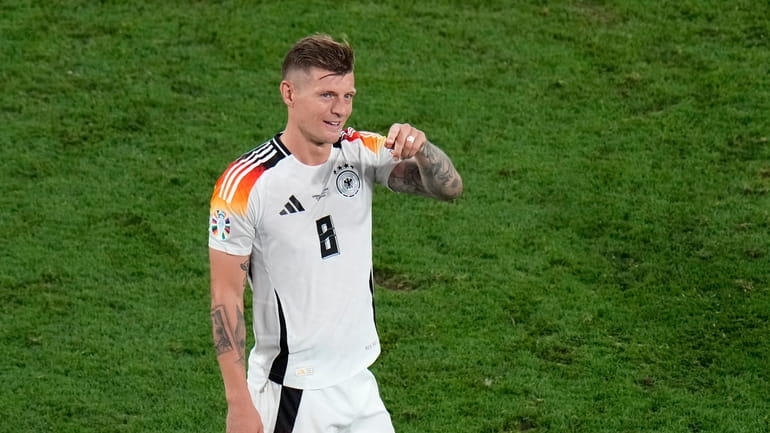Germany's Toni Kroos applauds fans at the end of the...