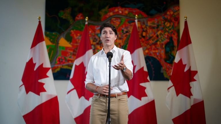 Canada Prime Minister Justin Trudeau speaks to reporters at the...