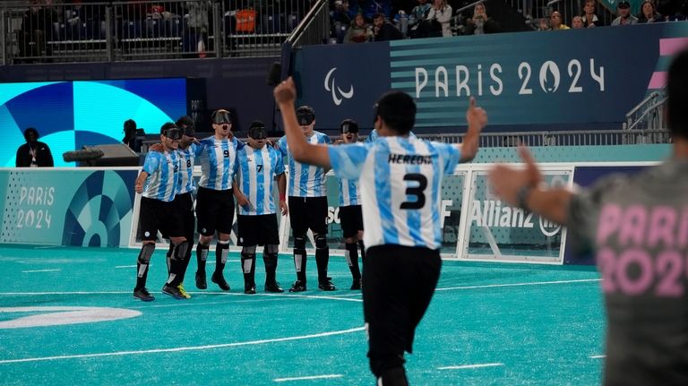 Argentina's Nahuel Heredia celebrates after scoring his penalty during the...