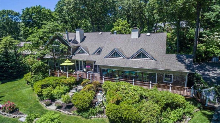 Priced at $1,449,000, this four-bedroom, 6½-bathroom Colonial on Spring Hollow...