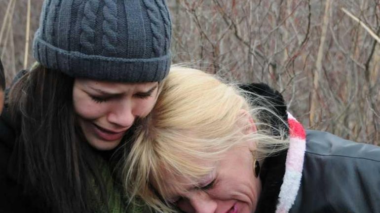 Mari Gilbert, with her daughter Sherre Gilbert, inside a marshy...