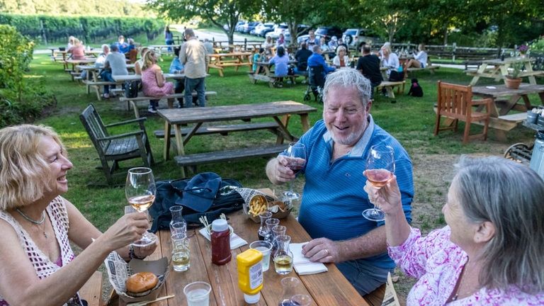 Patrons enjoying burger night at McCalls Wines in Cutchogue, Thursday...