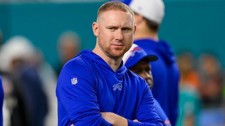 Buffalo Bills interim offensive coordinator Joe Brady stands the field...