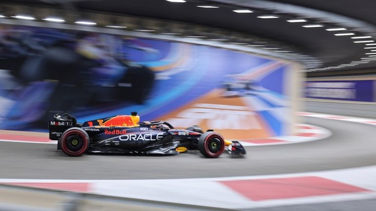 Red Bull driver Max Verstappen of the Netherlands steers his...