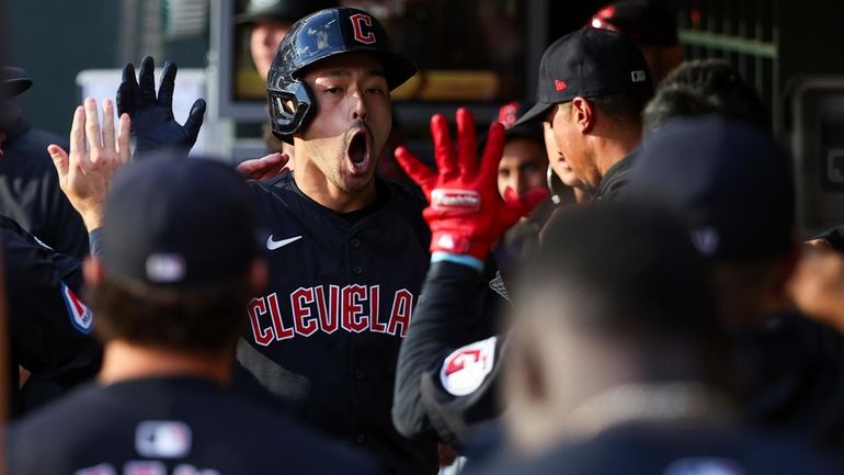 Cleveland Guardians' Steven Kwan celebrates his solo home run in...