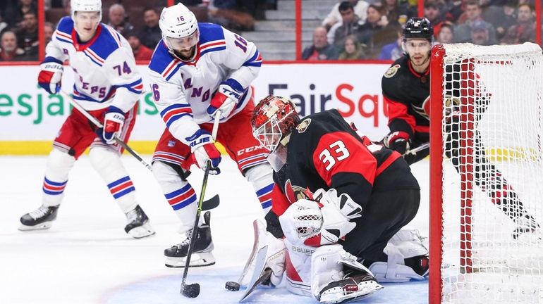 Cam Talbot #33 of the Ottawa Senators makes a save...