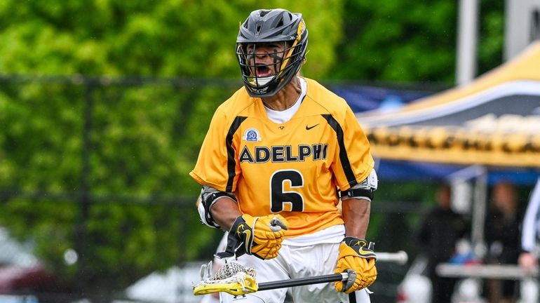 Kyle Lewis of Adelphi reacts after scoring a tying goal...