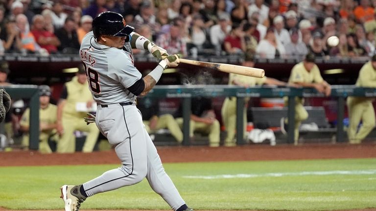 Detroit Tigers' Javier Báez hits an RBI double against the...