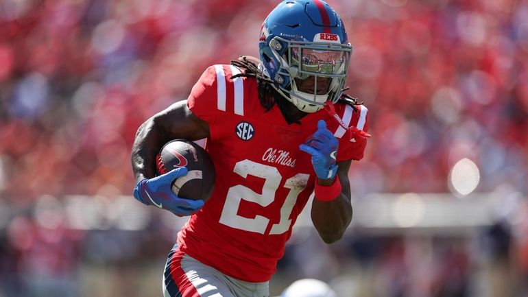 Mississippi running back Henry Parrish Jr. (21) runs the ball...