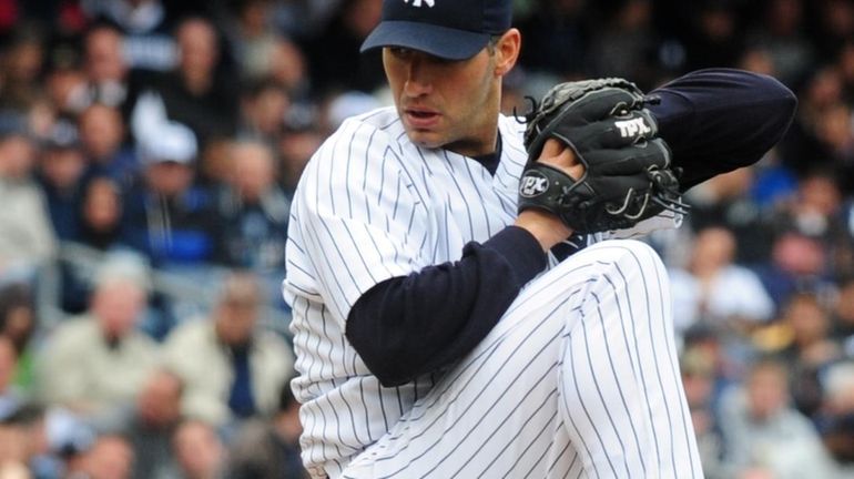 New York Yankees pitcher Andy Pettitte throws on the mound...