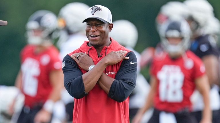 Atlanta Falcons head coach Raheem Morris watches an NFL training...