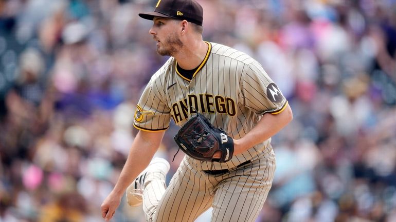 San Diego Padres relief pitcher Drew Carlton works against the...