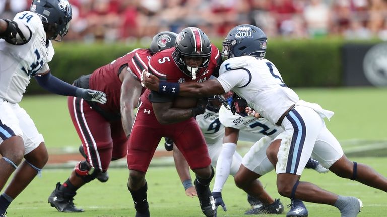 South Carolina running back Raheim Sanders (5) is tackled by...