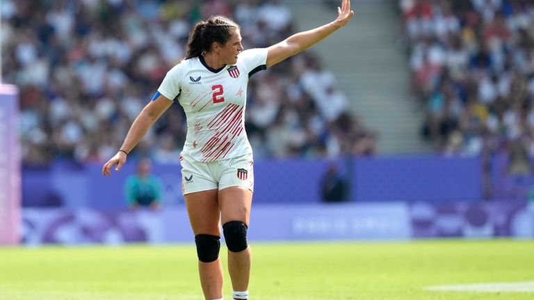 United States' Ilona Maher gestures to her teammates during the...