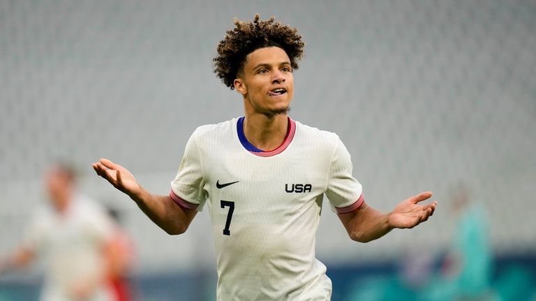 United States' Kevin Paredes celebrates scoring his side's 3rd goal...