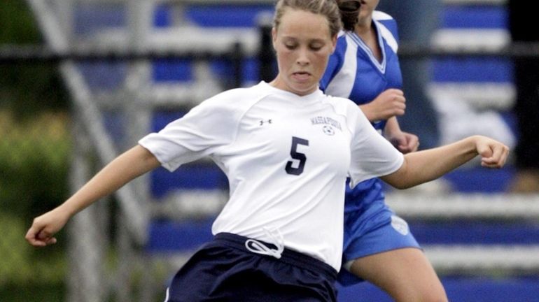 Massapequa's Rosie DiMartino takes a shot ahead of a pursuing...