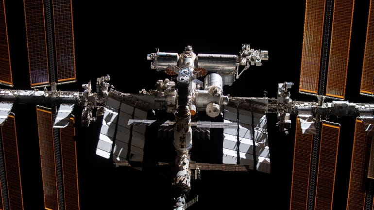 This photo provided by NASA shows the International Space Station...
