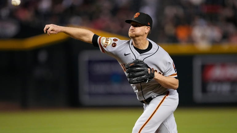 San Francisco Giants starting pitcher Alex Cobb throws against the...