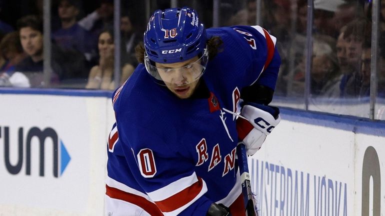 Artemi Panarin of the Rangers controls the puck against the...