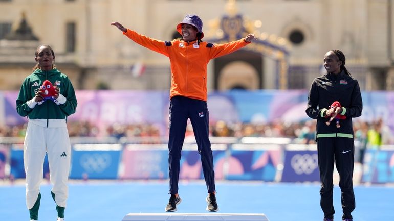 Gold medalist Sifan Hassan, of the Netherlands, center, silver medalist...