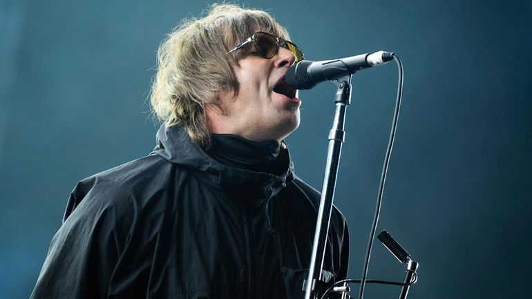 Liam Gallagher performs at the Reading Music Festival, England, Aug....