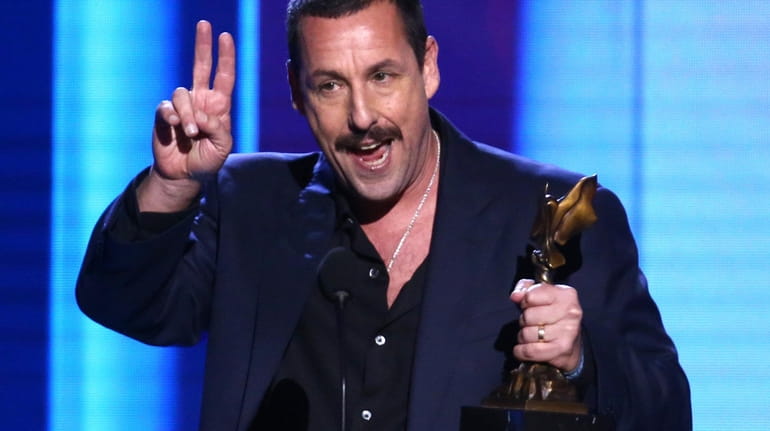 Adam Sandler accepts the best male lead award for his...