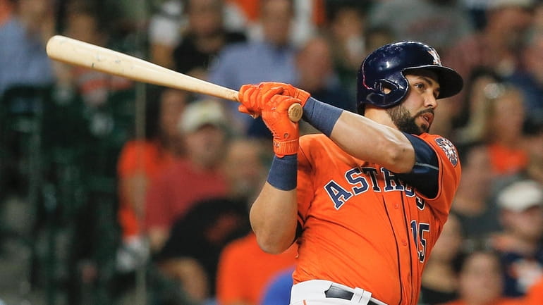 Carlos Beltran, shown here in 2017 with the Houston Astros,...