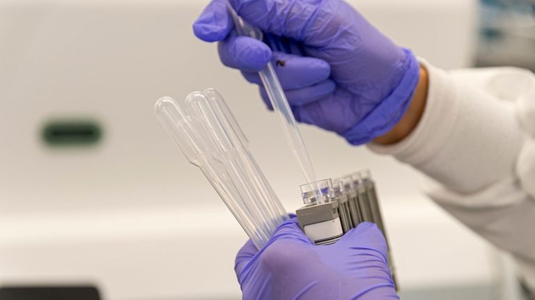 A lab technician prepares samples at a Northwell Health lab in...