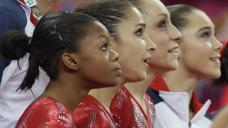U.S. gymnasts, from left to right, Gabrielle Douglas, Alexandra Raisman,...