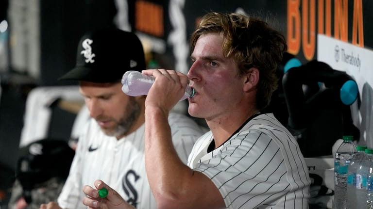 Chicago White Sox starting pitcher Jonathan Cannon takes a drink...