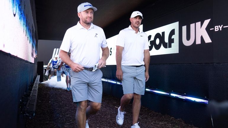 Graeme McDowell of Smash GC and Captain Brooks Koepka of...