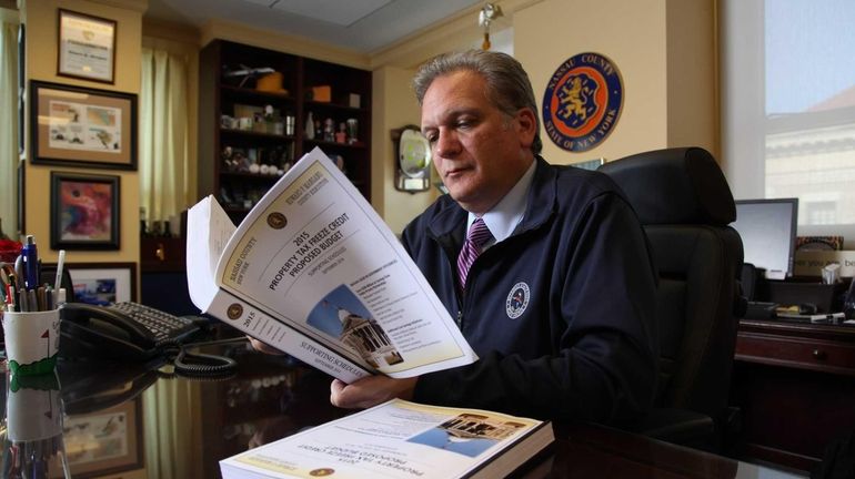 Nassau County Executive Edward Mangano works on the 2015 budget...