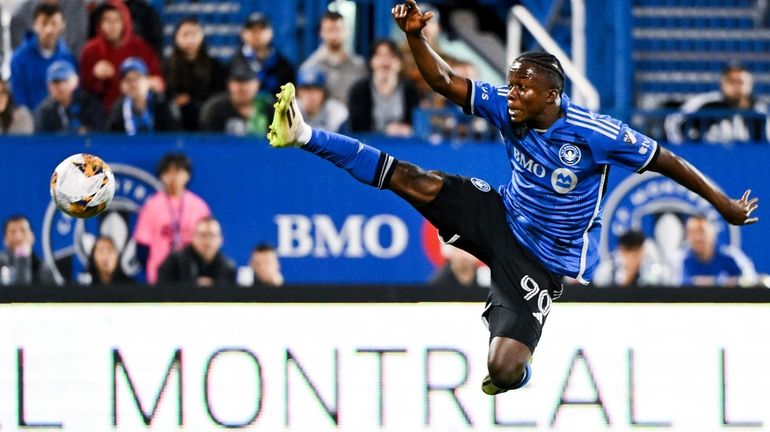 CF Montreal's Kwadwo Opoku jumps for the ball during the...