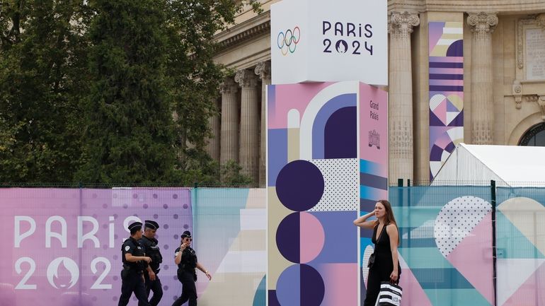 Police officers patrol outside the Grand Palais ahead of the...